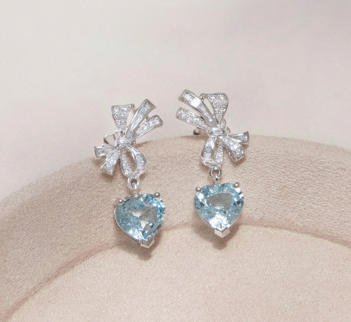Everblue heart-shaped aquamarine earrings with round and baguette diamond bows in 18K white gold Everblue heart-shaped aquamarine earrings with round and baguette diamond bows in 18K white gold