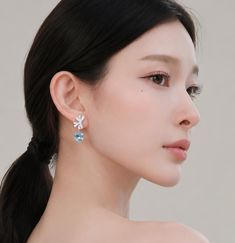 Everblue heart-shaped aquamarine earrings with round and baguette diamond bows in 18K white gold