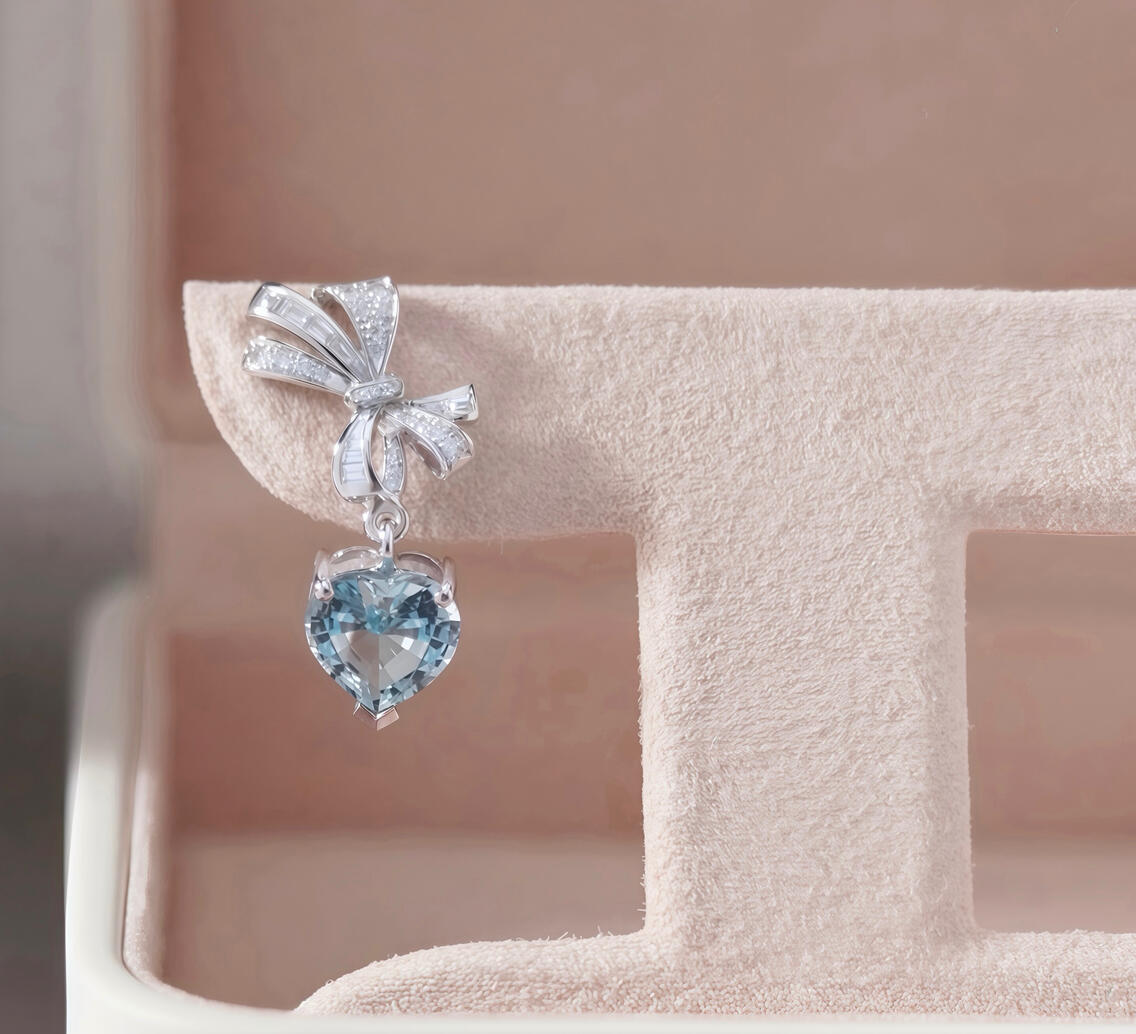 Everblue heart-shaped aquamarine earrings with round and baguette diamond bows in 18K white gold