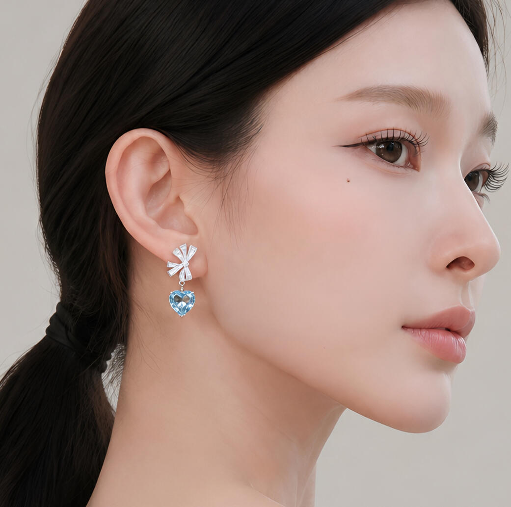 Everblue heart-shaped aquamarine earrings with round and baguette diamond bows in 18K white gold